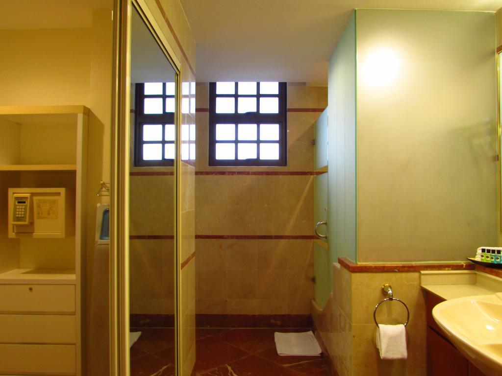 Alocassia Serviced Apartments Szingapúr Szoba fotó